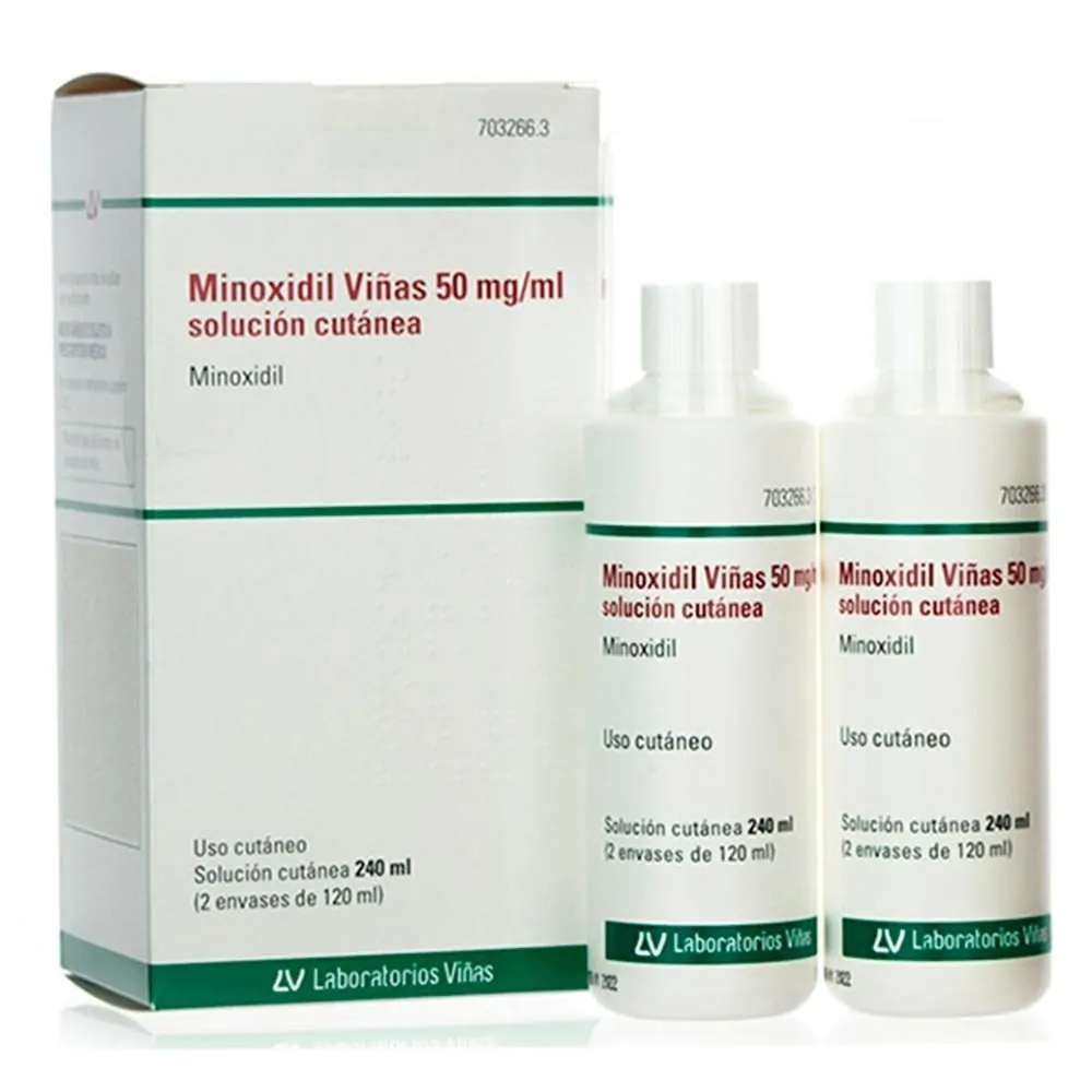Envase y dos frascos de Minoxidil Viñas 50 mg/ml solución cutánea sobre fondo blanco